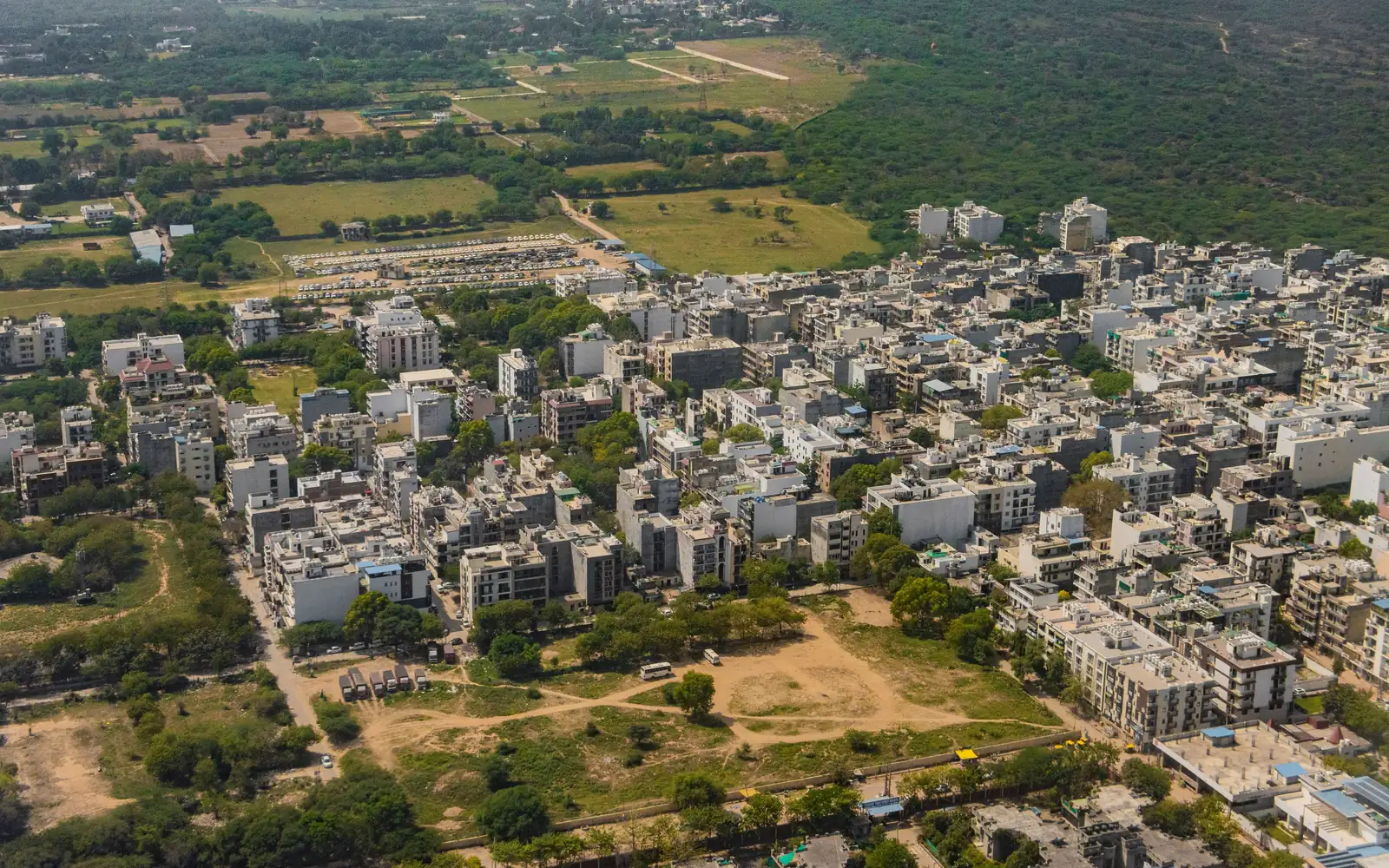 Gurugram from the air: low-rise blocks among trees